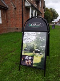 Mcqillian Signs | Large A-Board / Pavement Sign with Printed Photos & lettering on 1mm Foam 
      PVC, secured under transparent magnetic panel.